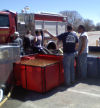 Volunteers training with pump.